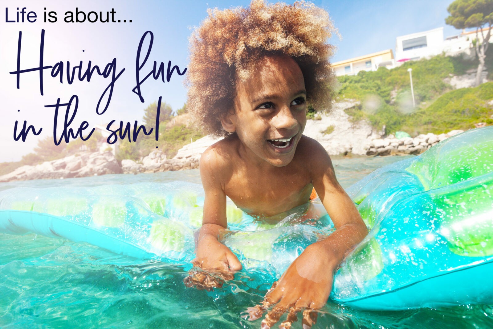 Happy African boy relaxing on swimming mattress